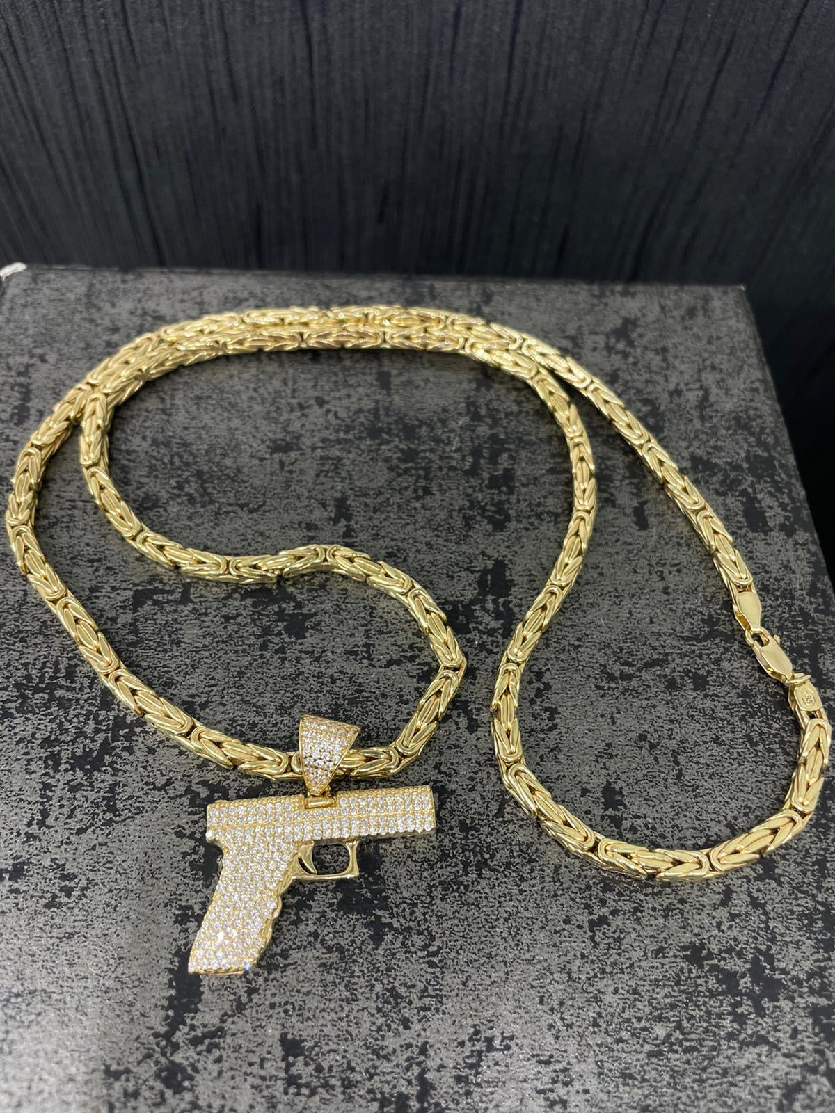 14 karaat gouden koningsketting met pistool hanger