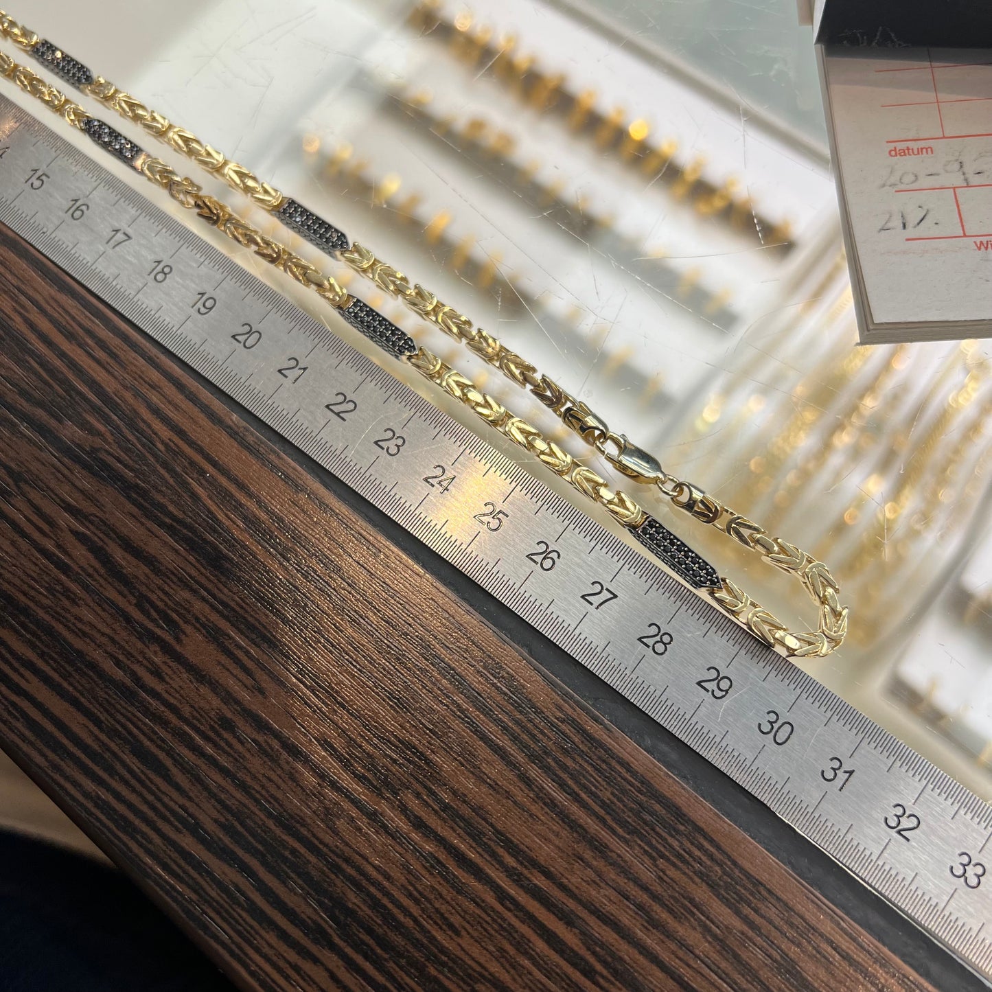 14 karaat gouden koningsketting met zwarte onyx stenen