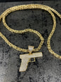 14 karaat gouden koningsketting met pistool hanger